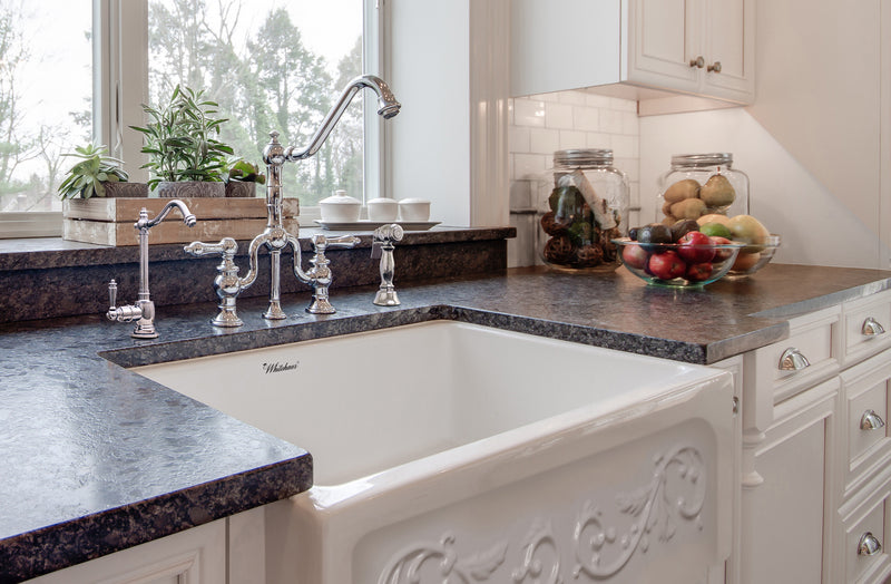 Whitehaus Glencove St. Ives 33" Front Apron Fireclay Sink with an Intricate Vine Design on one side and an Elegant Plain Beveled Front Apron on the Opposite Side